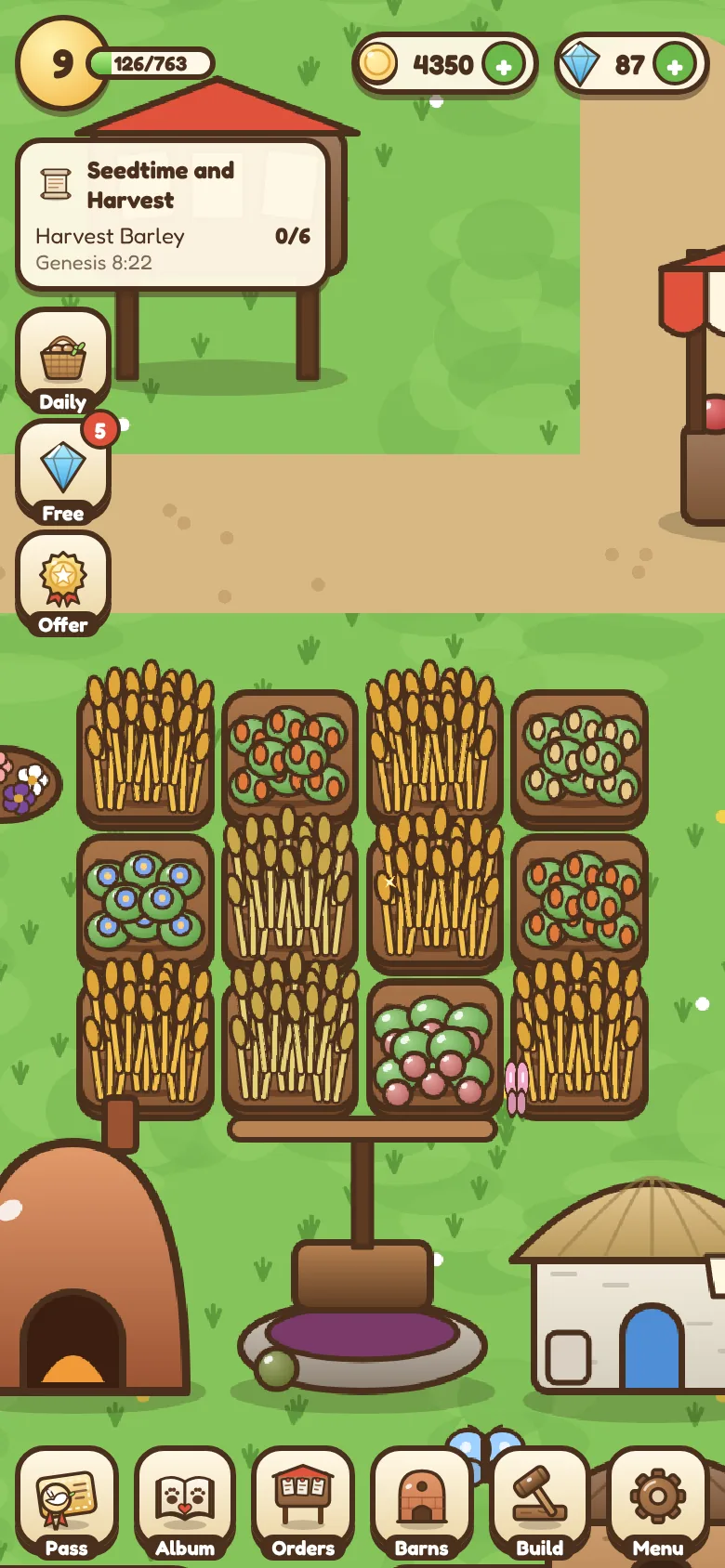 The farm with ripe fields of wheat and vegetables, a clay oven and a grape press